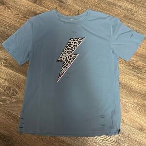 Women’s blue cheetah lightning bolt “distressed” t-shirt. Size L.